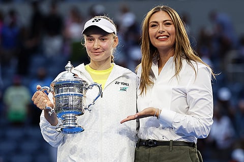 Elena Rybakina, of Kazakhstan, left, poses for a photo with former tennis player Maria Sharapova, right, after Rybakina won the women's singles final of the U.S. Open tennis championships against Aryna Sabalenka, of Belarus in New York.