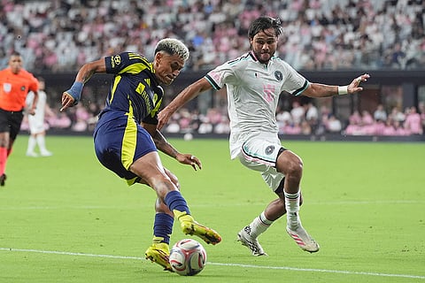 Nashville defender Andy Nájar control the ball as Inter Miami midfielder Telasco Segovia defends during the first half of an MLS soccer match in Miami.