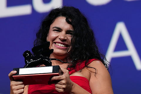 Director Alina Serban accepts the Armani Beauty audience award for 'I Matter' during the closing ceremony of the 83rd edition of the Venice Film Festival in Venice, Italy.