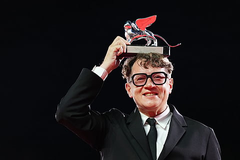 Ilya Khrzhanovsky, winner of the Silver Lion for best director for the film 'Dau', poses for photographers at the awards photo call during the closing ceremony of the 83rd edition of the Venice Film Festival in Venice, Italy.