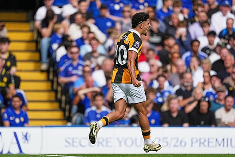 Hull City's Mohamed Belloumi celebrates after scoring his side's opening goal during the English Premier League soccer match between Chelsea and Hull City in London.