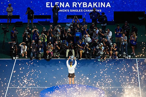 Elena Rybakina, of Kazakhstan, holds the trophy after she won the women's singles final of the U.S. Open tennis championships against Aryna Sabalenka, of Belarus in New York.