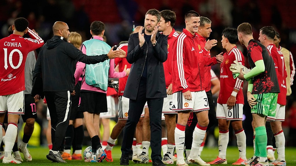 Manchester United's head coach Michael Carrick claps hands after winning the Champions League opening phase soccer match between Manchester United and Sabah FK in Manchester. - Dave Thompson/AP Photo