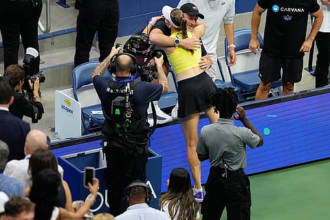 Elena Rybakina, of Kazakhstan, embraces members of her box after she won the women's singles final of the U.S. Open tennis championships against Aryna Sabalenka, of Belarus in New York.
