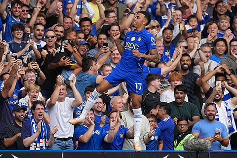 Chelsea's Morgan Rogers celebrates after scoring his side's opening goal during the English Premier League soccer match between Chelsea and Hull City in London.