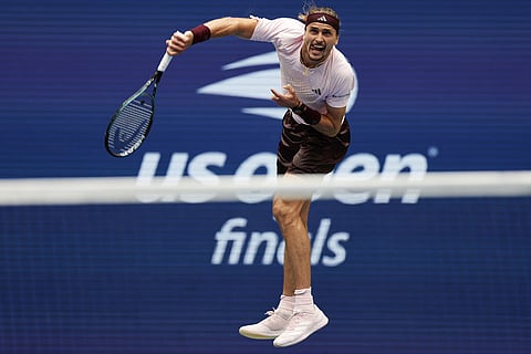 Alexander Zverev, of Germany, follows through on a serve to Ben Shelton, of the United States, during the men's singles final of the U.S. Open tennis championships in New York.