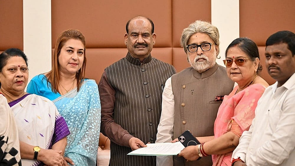 In this image received on June 14, 2026, Lok Sabha Speaker Om Birla receives a letter from TMC MPs including Sudip Bandyopadhyay, Satabdi Roy, Kakoli Ghosh Dastidar, Mala Roy and others for separate seating arrangement in the House, in New Delhi. - File Photo | Photo: Handout via PTI