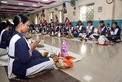 Students offer prayers to Lord Ganesh to observe Ganesh Chaturthi festival at Saraswati Shishu Vidya Mandir (SSVM) School, in Bhubaneswar, Monday, Sept. 14, 2026. 