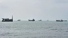 Commercial vessels are anchored in the Strait of Hormuz off Bandar Abbas, Iran. - | Photo: AP/Vahid Salemi