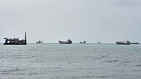 Hormuz Shipping Recovers, But Middle East Oil Export Constraints Persist | Photo: AP/Vahid Salemi : Commercial vessels are anchored in the Strait of Hormuz off Bandar Abbas, Iran.