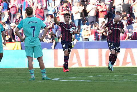 Levante's Ivan Romero celebrates after scoring his side's first goal during the Spanish La Liga soccer match between Levante and Barcelona in Valencia, Spain, Sunday, Sept. 13, 2026.
