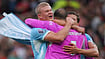 Ian Hodgson/AP Photo : Manchester City's Erling Haaland, left, Manchester City's goalkeeper Gianluigi Donnarumma, Manchester City's Ruben Dias celebrate after the English Premier League soccer match between Manchester United and Manchester City in Manchester.