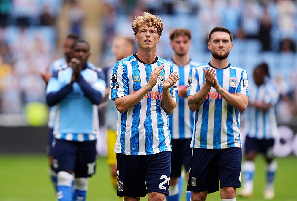 Coventry City's Victor Torp, centre, applauds the fans after the English Premier League soccer match between Coventry City and Brighton and Hove Albion in Coventry, England, Sunday Sept. 13, 2026.  - | Photo: Mike Egerton/PA via AP