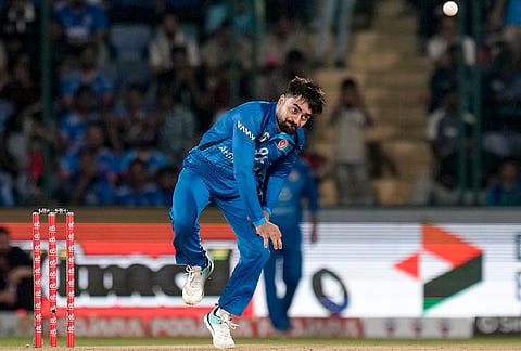 Afghanistan's Rashid Khan bowls during the first T20I cricket match between India and Afghanistan, in New Delhi, Sunday, Sept. 13, 2026.
