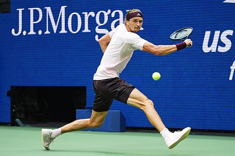 Alexander Zverev, of Germany, reaches to return the ball to Ben Shelton, of the United States, during the men's singles final of the U.S. Open tennis championships in New York.