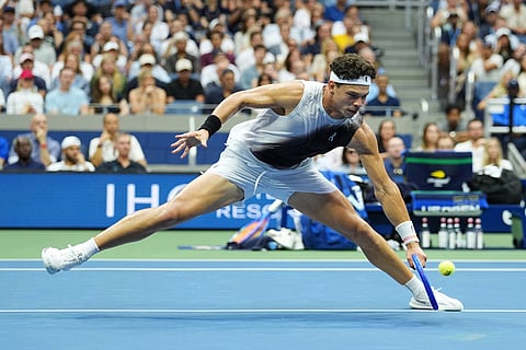 Ben Shelton, of the United States, returns the ball to Alexander Zverev, of Germany, during the men's singles final of the U.S. Open tennis championships in New York.