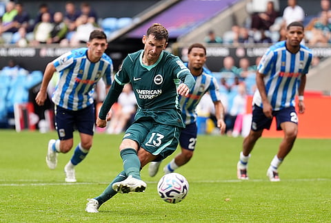 Brighton and Hove Albion's Pascal Gross scores their side's third goal of the game from a penalty during the English Premier League soccer match between Coventry City and Brighton and Hove Albion in Coventry, England, Sunday Sept. 13, 2026. 
