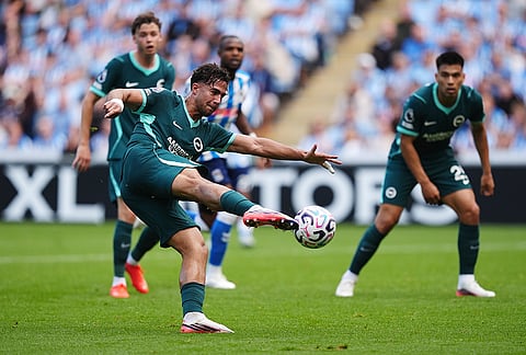 Brighton and Hove Albion's Charalampos Kostoulas scores their side's first goal during the English Premier League soccer match between Coventry City and Brighton and Hove Albion in Coventry, England, Sunday Sept. 13, 2026. 
