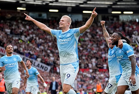 Manchester City's Erling Haaland celebrates after scoring his sides first goal during the English Premier League soccer match against Manchester United in Manchester, England, Sunday Sept. 13, 2026. 