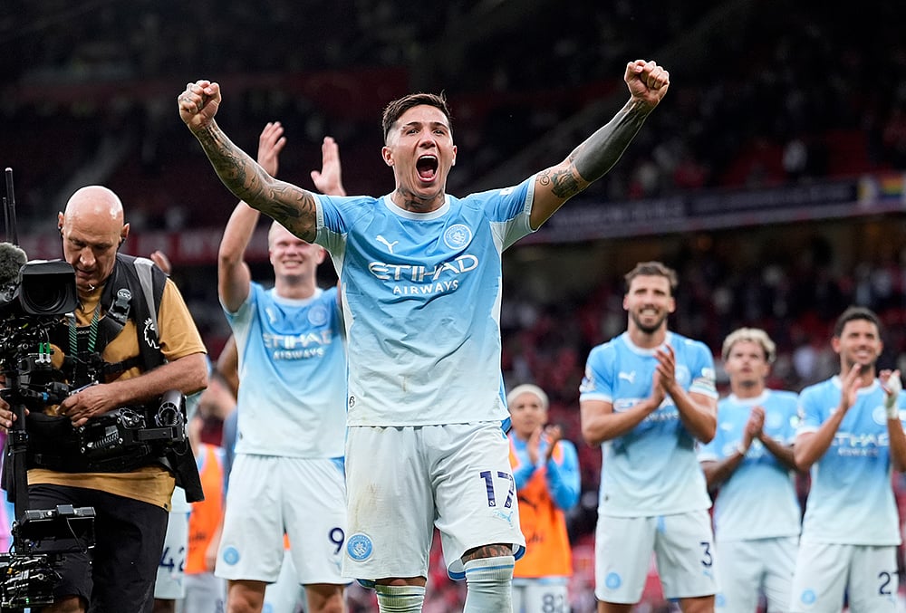 Manchester City's Enzo Fernandez celebrates in front of the away fans after the English Premier League soccer match against Manchester United in Manchester, England, Sunday Sept. 13, 2026.
 - | Photo: Peter Byrne/PA via AP