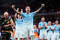 Manchester Is Blue Again! Haaland Fires 10-Man City To Derby Glory | Photo: Peter Byrne/PA via AP : Manchester City's Enzo Fernandez celebrates in front of the away fans after the English Premier League soccer match against Manchester United in Manchester, England, Sunday Sept. 13, 2026.