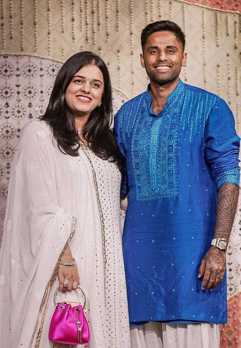 Cricketer Surya Kumar Yadav along with his wife during ‘Ganesh Chaturthi’ celebrations at the residence of Reliance Industries Chairman Mukesh Ambani, in Mumbai, Maharashtra.