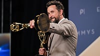| Photo: Richard Shotwell/Invision/AP : Noah Wyle poses in the press room with the awards for outstanding lead actor in a drama series for "The Pitt" and outstanding drama series for "The Pitt" during the 78th Emmy Awards on Monday, Sept. 14, 2026, at the JW Marriott in Los Angeles. 