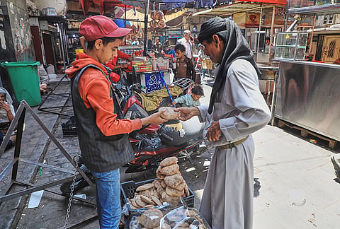 A man buys bread in Sanaa, Yemen, Monday, Sept. 14, 2026. 