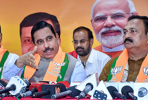 Union Minister Pralhad Joshi addresses the media as Central MLA Mahesh Tenginakai looks on, in Hubballi, Karnataka.