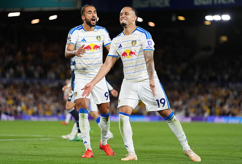 Leeds United's Noah Okafor, right, celebrates scoring their side's fourth goal with Dominic Calvert-Lewin during the English Premier League soccer match between Leeds United and Newcastle United in Leeds, England, Monday, Sept. 14, 2026.  - | Photo: Annabel Lee-Ellis/PA via AP