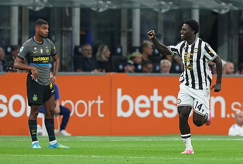 Udinese's James Abankwah celebrates after scoring his sides first goal during the Serie A soccer match between Inter Milan and Udinese in Milan, Italy, Monday, Sept. 14, 2026.

