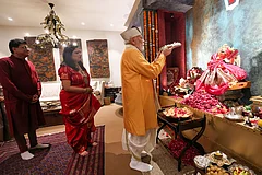 In this image received on Sept. 14, 2026, Prime Minister Narendra Modi performs a ritual as Union Minister Piyush Goyal and his wife look on during the PM's visit to Union Minister’s residence on ‘Ganesh Chaturthi’ festival, in New Delhi. - | Photo: PMO via PTI
