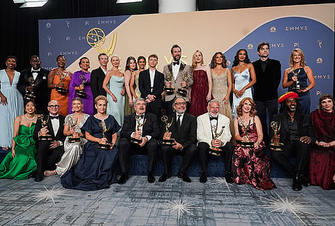 Te team from "The Pitt" pose with the award for outstanding drama series in the press room during the 78th Emmy Awards on Monday, Sept. 14, 2026, at the JW Marriott in Los Angeles. 