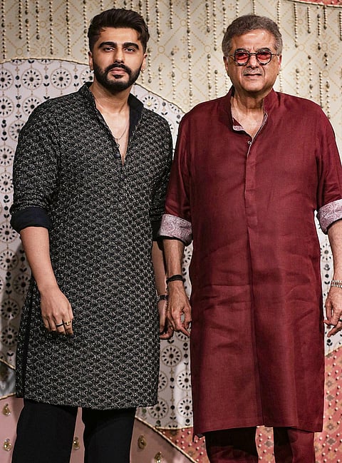 Bollywood actor Arjun Kapoor, left, with film producer Boney Kapoor during ‘Ganesh Chaturthi’ celebrations at the residence of Reliance Industries Chairman Mukesh Ambani, in Mumbai, Maharashtra.