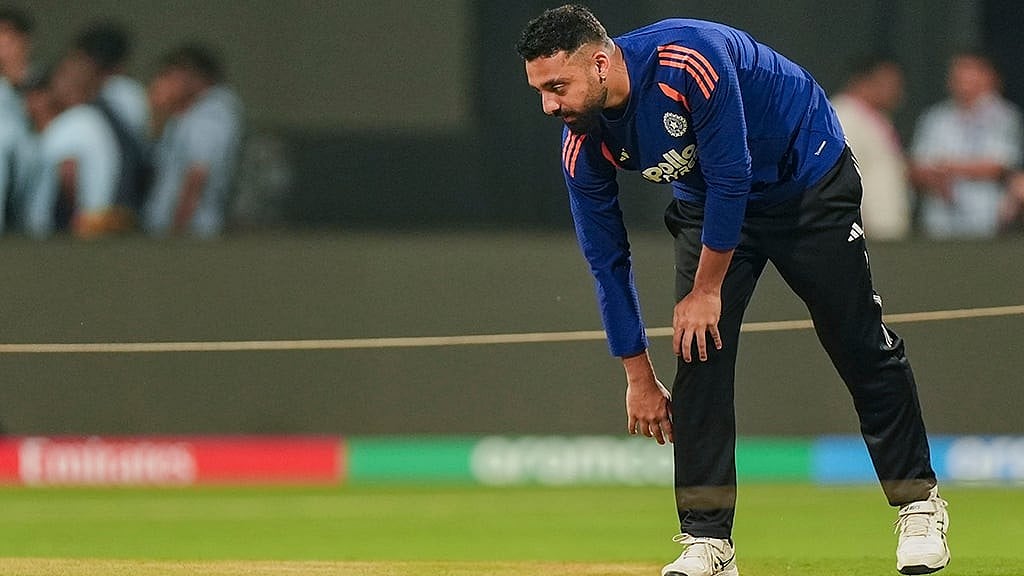 India's Varun Chakaravarthy inspects the pitch during a training session ahead of the ICC Men's T20 World Cup 2026 semi-final cricket match between India and England, in Mumbai. - | Photo: PTI/Kunal Patil