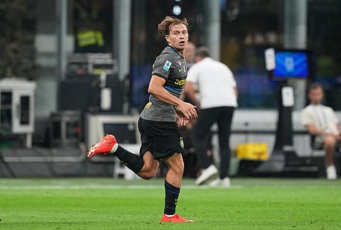 Inter Milan's Nicolo Barella celebrates after scoring his sides second goal during the Serie A soccer match between Inter Milan and Udinese in Milan, Italy, Monday, Sept. 14, 2026. 