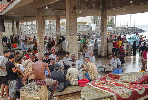 People gather to buy fresh fish at Sirah Fish Market in Aden, Yemen, Tuesday, Sept. 15, 2026. 