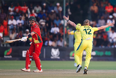 Zimbabwe's batsman Bradley Evans, left, reacts after his dismissal by Australia's bowler Nathan Ellis during the first One Day International cricket match between Zimbabwe and Australia in Harare, Zimbabwe, Tuesday, Sept.15, 2026.