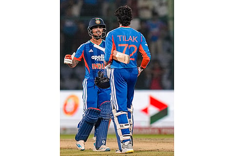 India's Tilak Verma greeted by Ishan Kishan after India wins the second T20I cricket match between India and Afghanistan, in New Delhi.