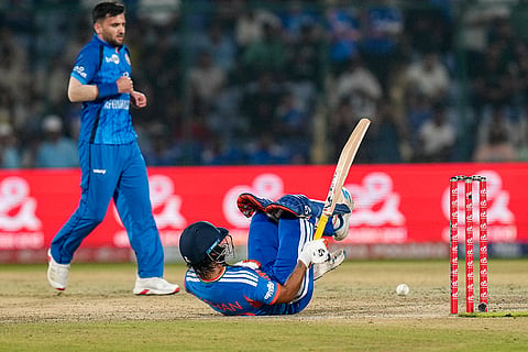 India's Ishan Kishan gets hit by the ball during the second T20I cricket match between India and Afghanistan, in New Delhi.