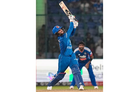Afghanistan's Azmatullah Omarzai plays a shot during the second T20I cricket match between India and Afghanistan, in New Delhi.