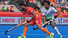 India's Sukjeet Singh in action in front of Pakistan's Muhammad Ammad during the World Cup Field Hockey pool D match between India and Pakistan in Amstelveen, Netherlands. - | Photo: AP/Patrick Post
