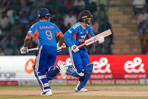 India's Sanju Samson, left, and Abhishek Sharma, right, run between the wickets during the second T20I cricket match of the between India and Afghanistan, in New Delhi.