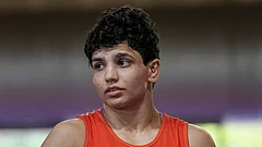 Nishu competes in a 53kg category wrestling match against Vinesh Phogat during the Asian Games selection trials, in New Delhi. - | Photo: PTI/Kamal Kishore
