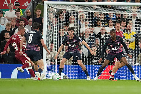 Liverpool's Alexis Mac Allister scores first goal during the third-round English Football League soccer match between Liverpool and Tottenham in Liverpool, England.