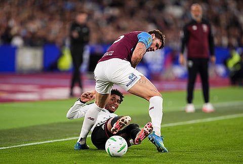 West Ham United's Morato, top, and Fulham's Kevin battle for the ball during the League Cup third round soccer match between West Ham United and Fulham in London, Tuesday, Sept. 15, 2026. 
