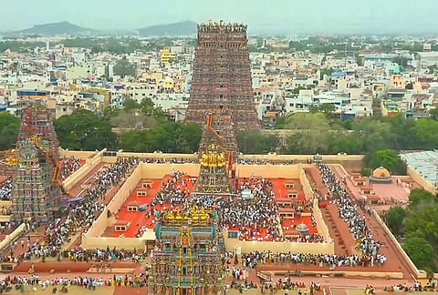 People gather during the Maha Kumbabhishekam, the consecration ceremony, of the renowned Sri Meenakshi Sundareshwarar Temple, in Madurai. 
