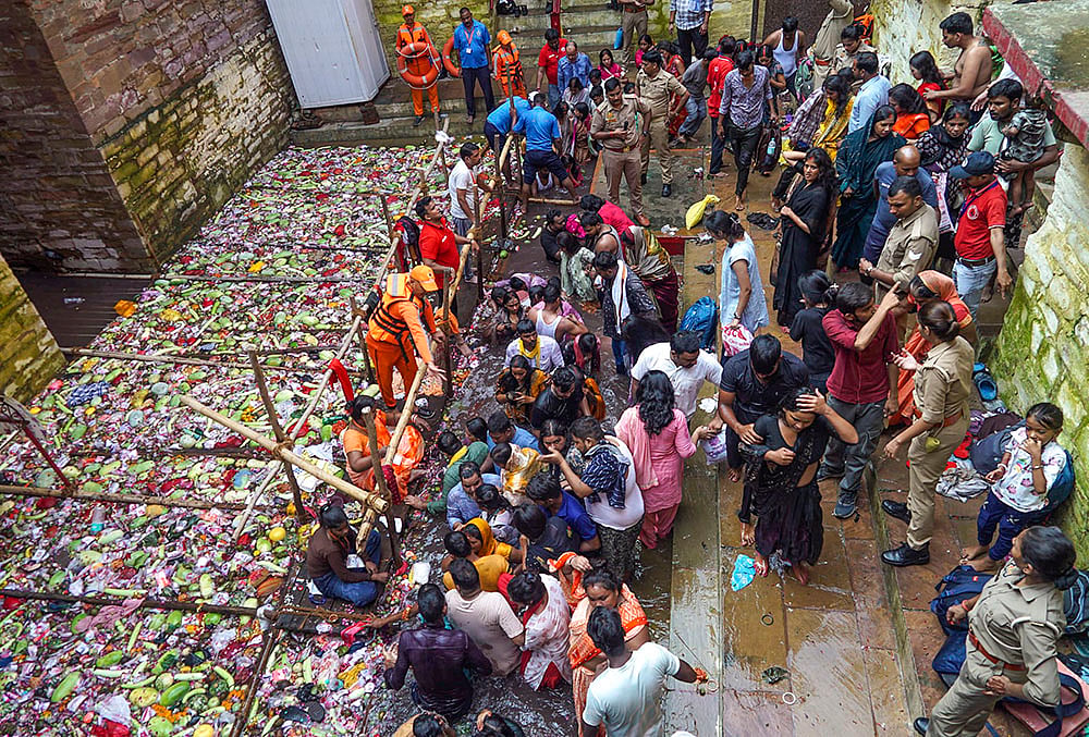 People take a dip at Lolark Kund in Varanasi