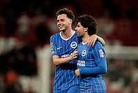 | Photo: AP/Dave Thompson : Brighton's Maxim De Cuyper, left, and Brighton's Ferdi Kadioglu celebrate at the end of the English League Cup third round soccer match between Manchester United and Brighton and Hove Albion in Manchester, England, Wednesday, Sept. 16, 2026. 