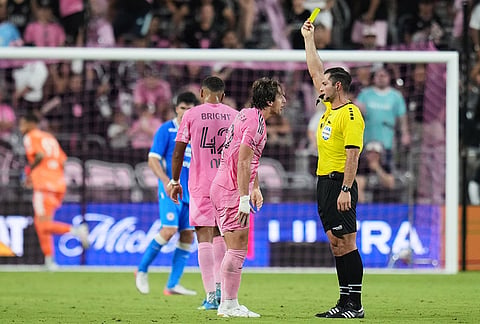 Inter Miami midfielder Matías Galarza, left gets a yellow card during the first half of the Campeones Cup soccer match against Cruz Azul, Wednesday, Sept. 16, 2026, in Miami. 
